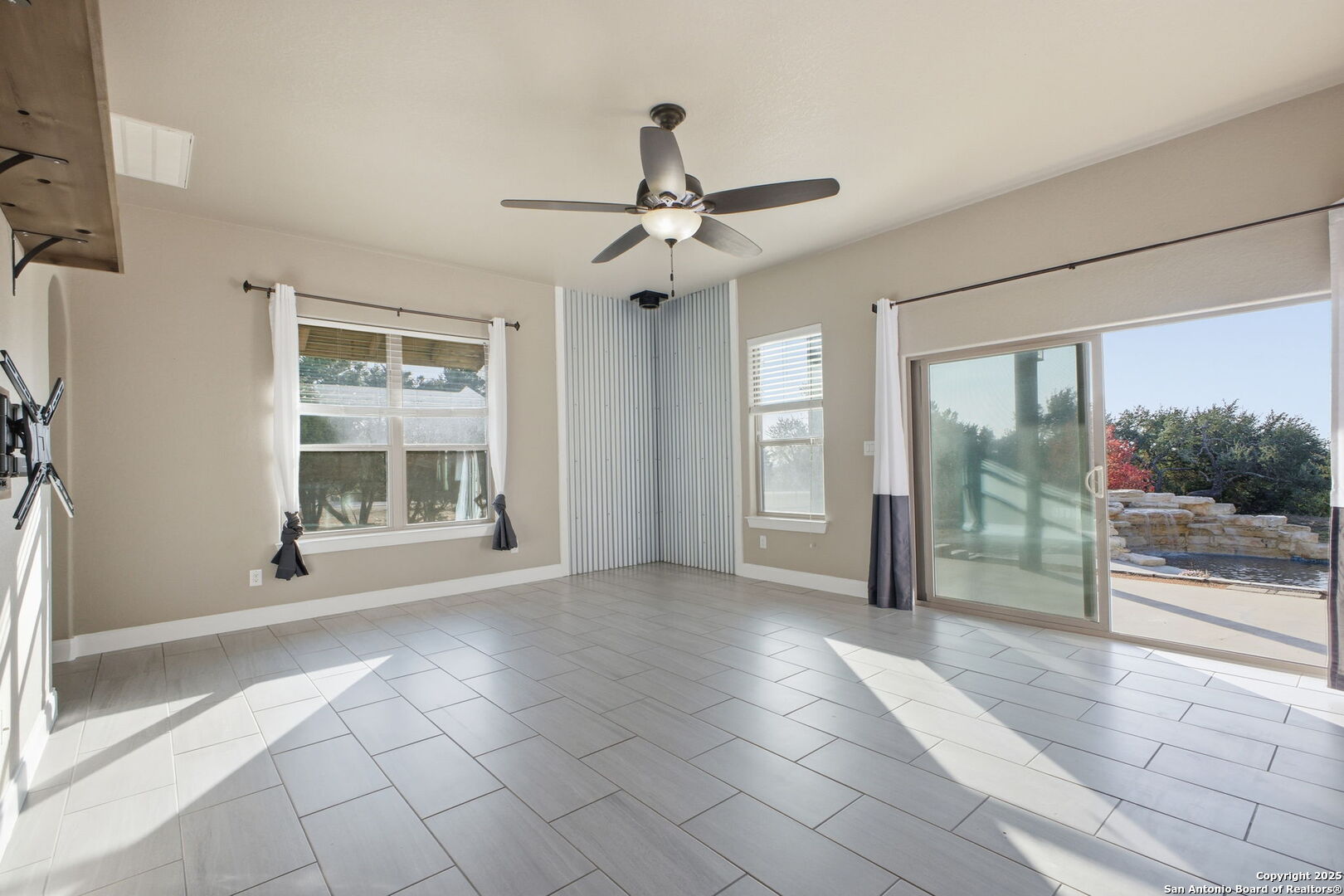 1275 Mystic Breeze Spring Branch, TX 78070 - Photo 9 of 50 a view of an empty room with window chandelier