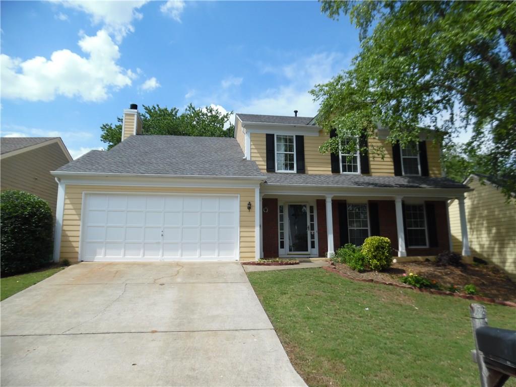 545 Barsham Way Johns Creek, GA 30097 - Photo 1 of 1 a front view of a house with garden