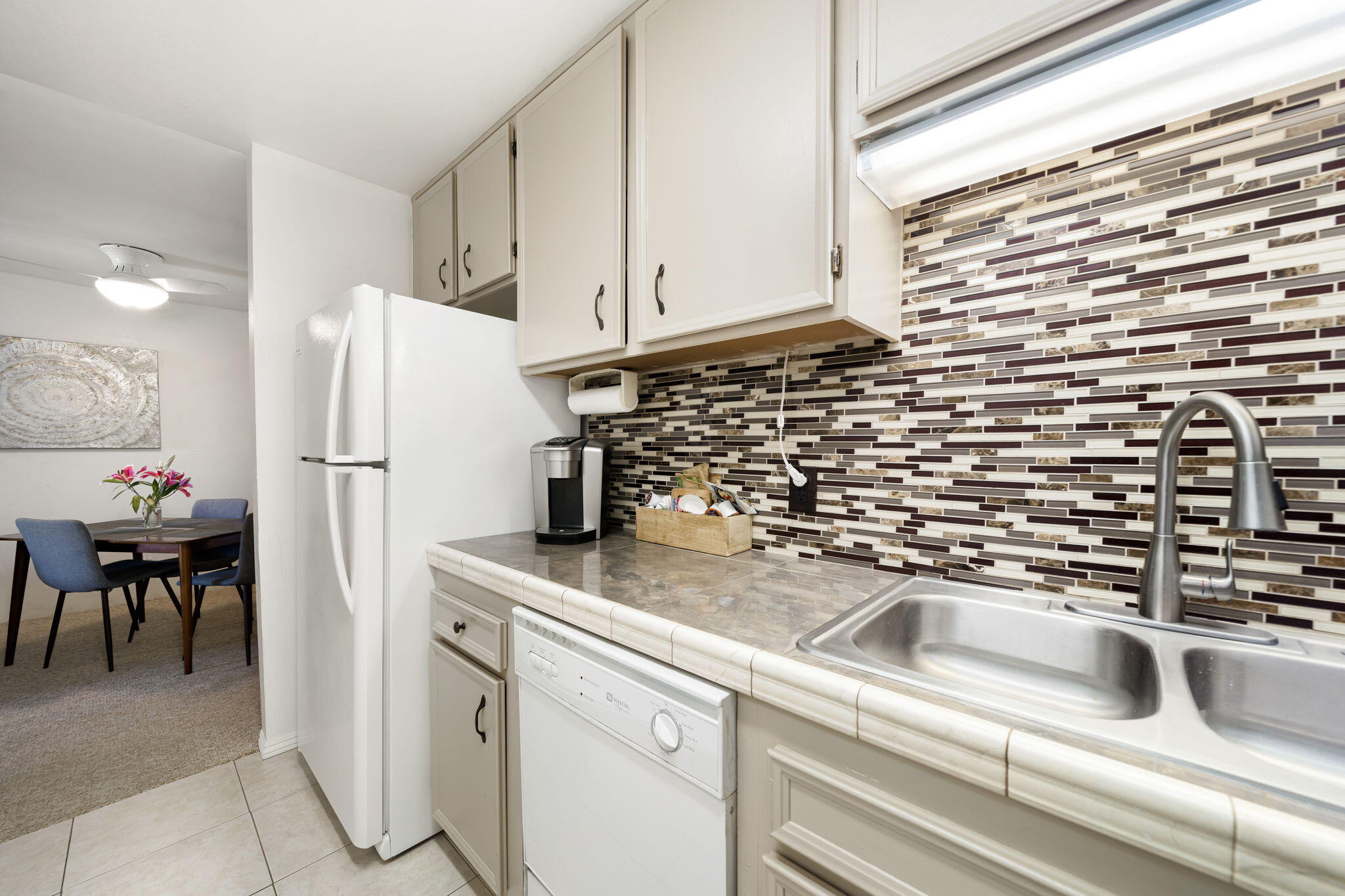 2860 North Los Felices Road, Unit 214 Palm Springs, CA 92262 - Photo 15 of 26 a kitchen with a refrigerator and a sink