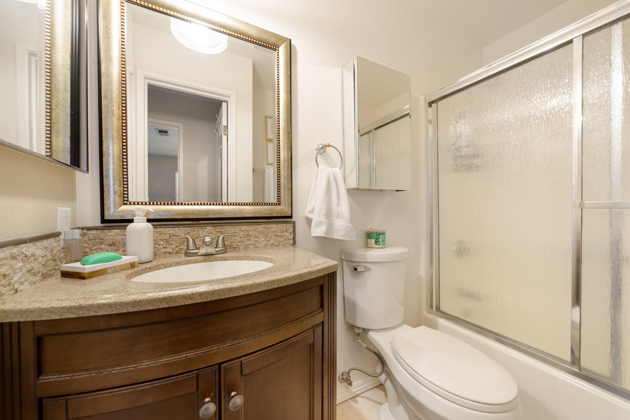 2860 North Los Felices Road, Unit 214 Palm Springs, CA 92262 - Photo 18 of 26 a bathroom with a sink a toilet and shower