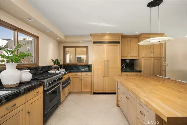 a kitchen with a sink stove and refrigerator