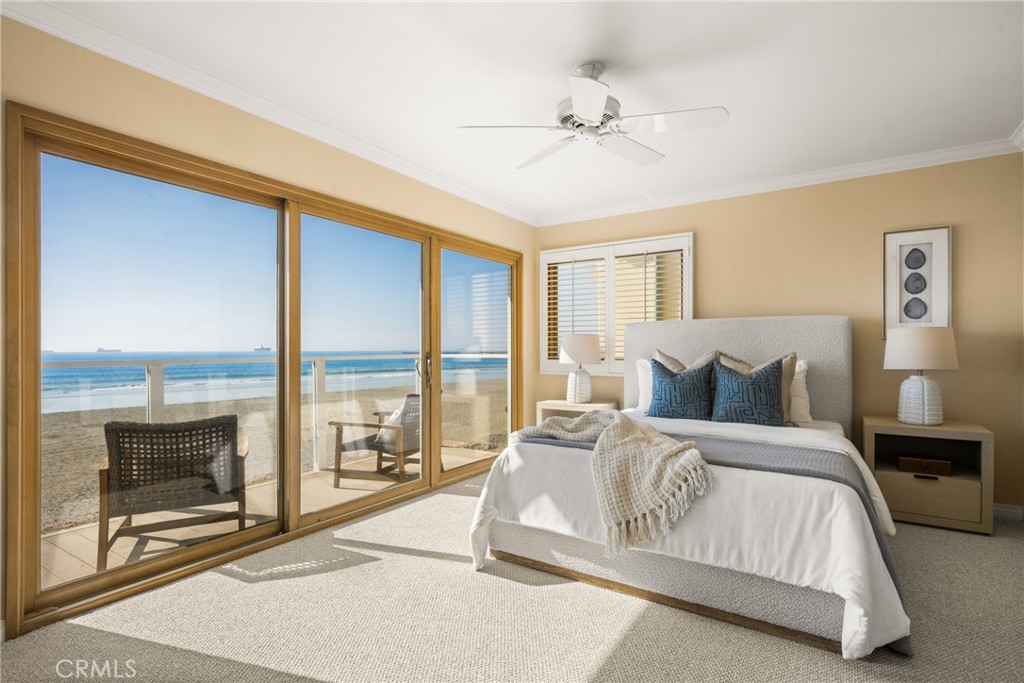 78 A Surfside Avenue Surfside, CA 90743 - Photo 25 of 45 a spacious bedroom with a large bed and a balcony view