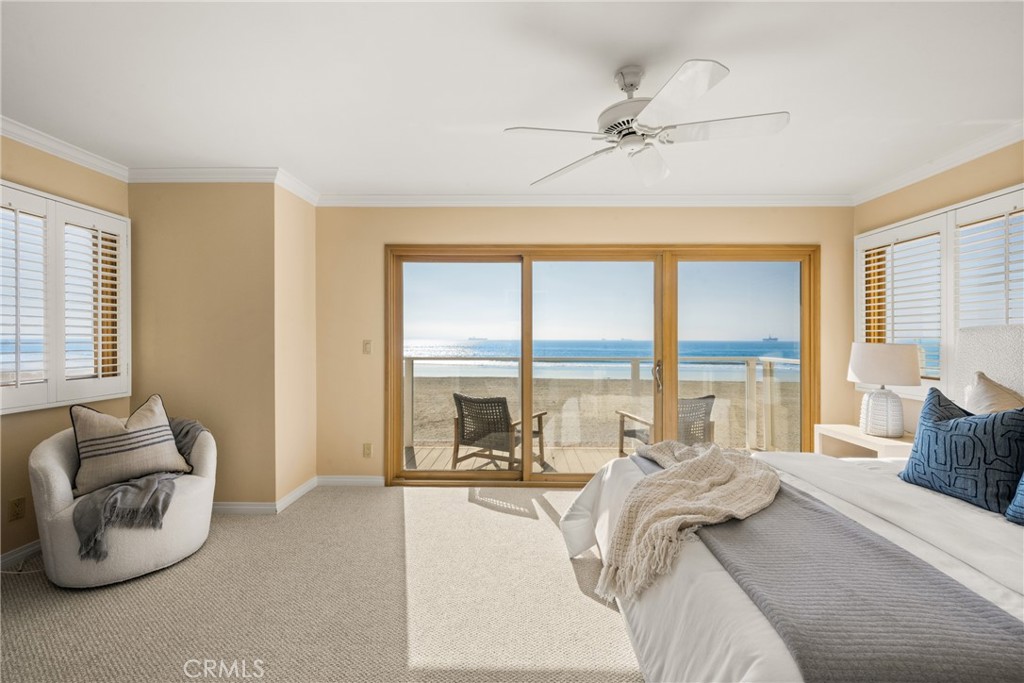78 A Surfside Avenue Surfside, CA 90743 - Photo 26 of 45 a living room with furniture and floor to ceiling windows
