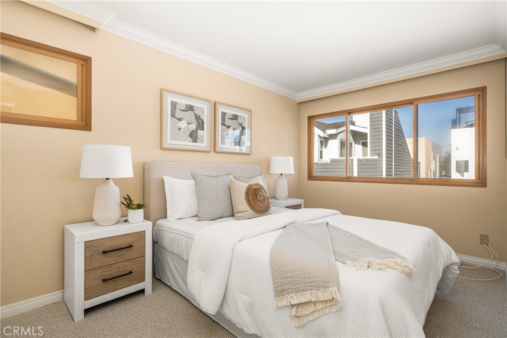 78 A Surfside Avenue Surfside, CA 90743 - Photo 30 of 45 a bedroom with a bed and a window