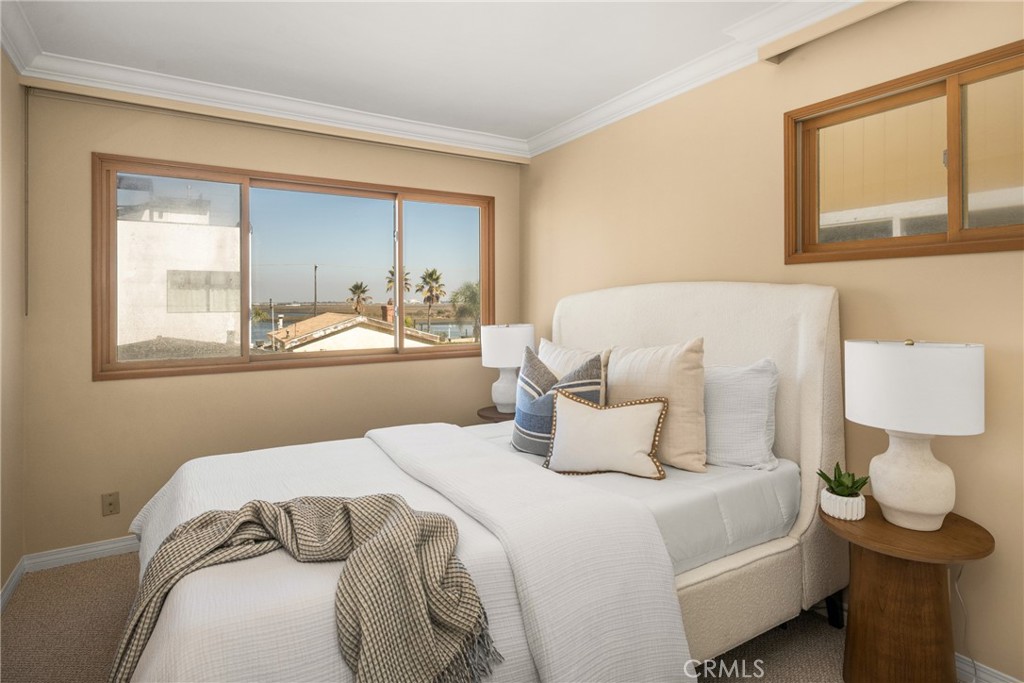 78 A Surfside Avenue Surfside, CA 90743 - Photo 32 of 45 a bedroom with a bed and window