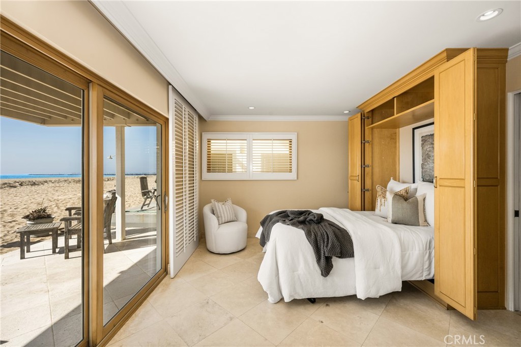 78 A Surfside Avenue Surfside, CA 90743 - Photo 5 of 45 a bedroom with bed and glass door