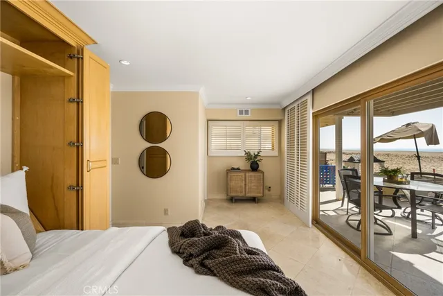 a bedroom with a bed and glass walk in closet