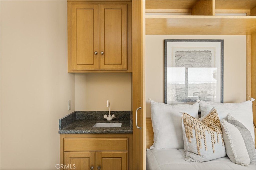 78 A Surfside Avenue Surfside, CA 90743 - Photo 9 of 45 a bathroom with a granite countertop sink and a window