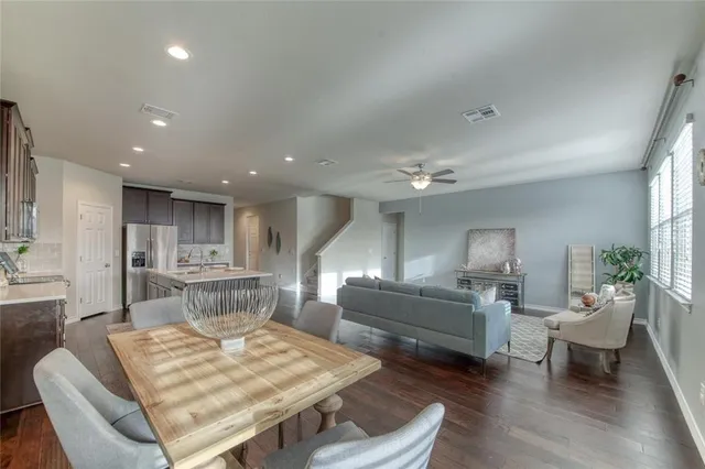 a kitchen with stainless steel appliances a sink stove and cabinets