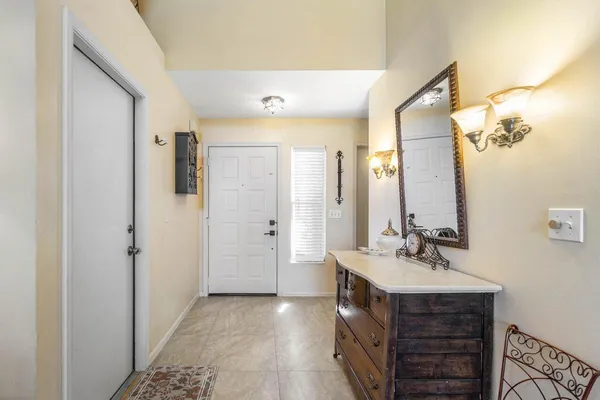 a bathroom with a sink double vanity and a mirror