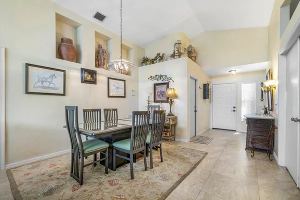 a view of a dining room with furniture