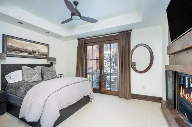 a bedroom with a large bed and a large window