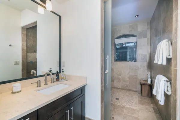 a bathroom with a sink and a mirror
