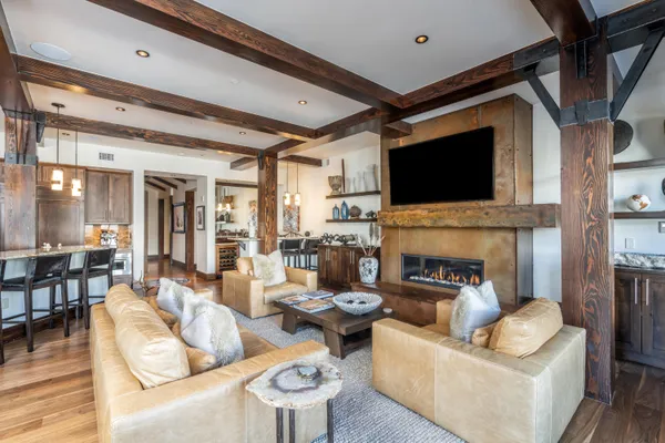 a living room with fireplace furniture and a flat screen tv