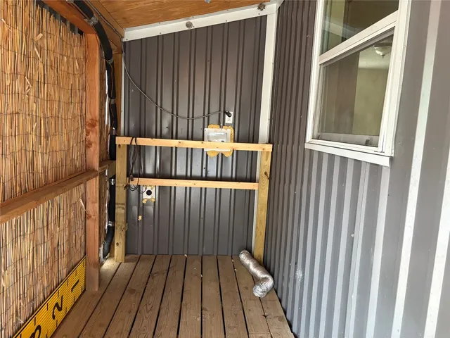 a view of porch with wooden floor
