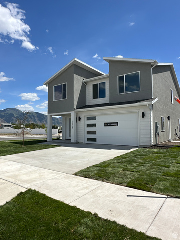 1225 West 500 South Logan, UT 84321 - Photo 2 of 39 Contemporary two-story residence featuring a gray stucco exterior and white siding accents