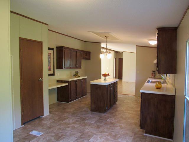 21 Dog Branch Road Pleasant Shade, TN 37145 - Photo 2 of 30 Taken from the breakfast nook looking at the beautiful kitchen - pantry and utility closet are to the left.