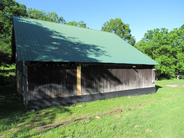 21 Dog Branch Road Pleasant Shade, TN 37145 - Photo 12 of 30 Metal roof on barn appears to be only a few years old.
