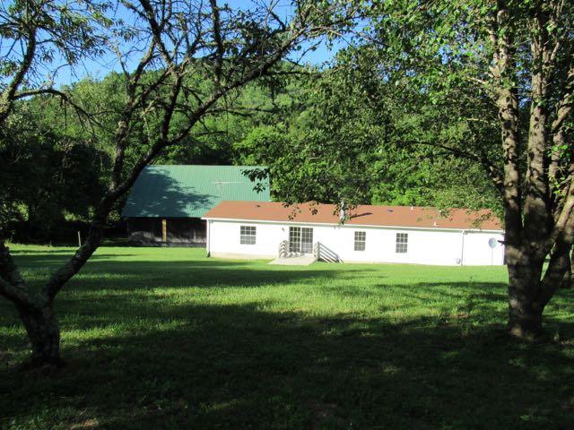 21 Dog Branch Road Pleasant Shade, TN 37145 - Photo 14 of 30 Standing in the back yard looking twd back of house and side of barn.