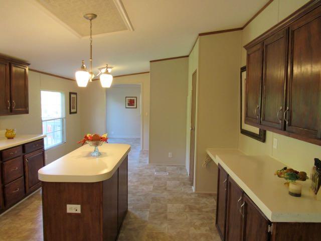 21 Dog Branch Road Pleasant Shade, TN 37145 - Photo 3 of 30 Gorgeous kitchen has a new stove & light fixtures, resurfaced countertops, abundant cabinets with new hardware and finish, island, and desk.