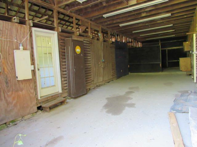 21 Dog Branch Road Pleasant Shade, TN 37145 - Photo 26 of 30 all through the middle of the barn there's poured concrete. The's an office, tack room, work area and stalls off to each side.