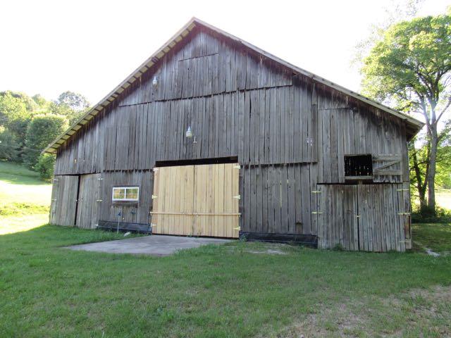 21 Dog Branch Road Pleasant Shade, TN 37145 - Photo 8 of 30 What a barn! Well built with recent improvements and repairs. Has it's own electric meter, 220 amp breaker box, and wiring all over with lots of lighting and plugs.