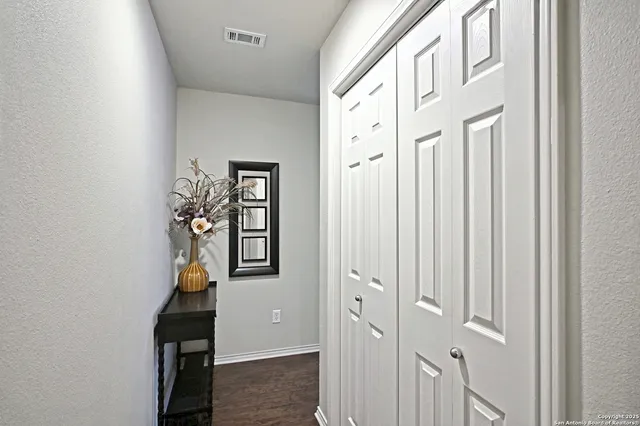 wooden floor with windows and closet