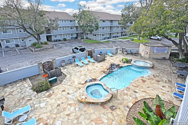 a wooden bench sitting in the middle of a yard