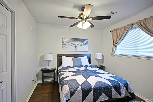 a bedroom with a bed and window