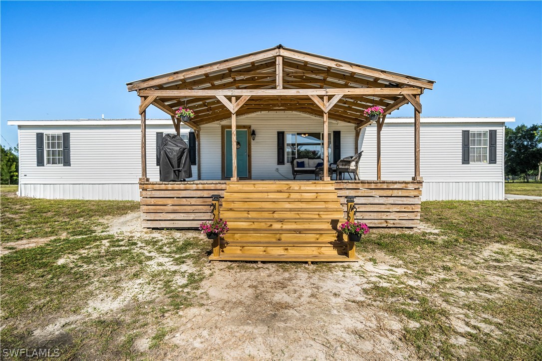 2401 Wendy Road Fort Denaud, FL 33935 - Photo 1 of 35 a view of a house with wooden floor