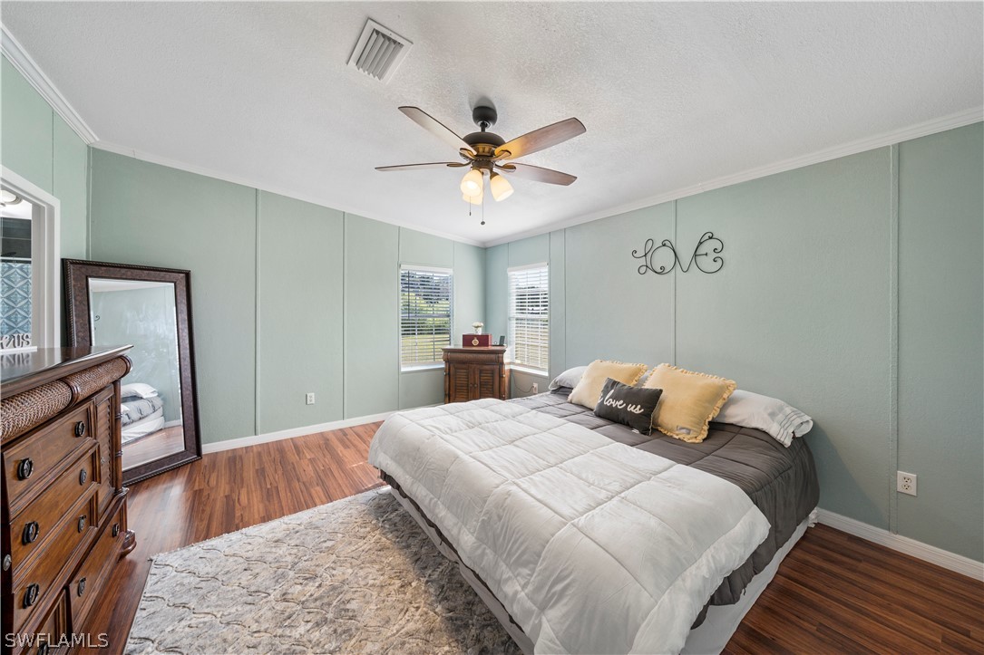 2401 Wendy Road Fort Denaud, FL 33935 - Photo 13 of 35 a bedroom with a bed dresser and a window