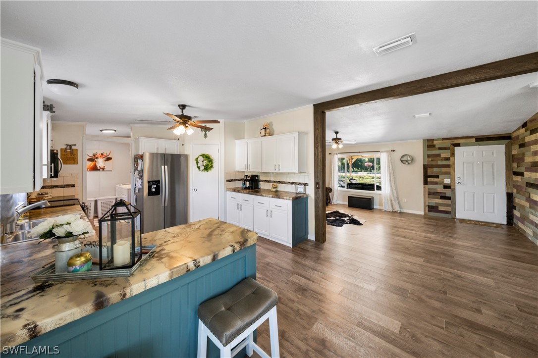 2401 Wendy Road Fort Denaud, FL 33935 - Photo 21 of 35 a large living room with furniture and a wooden floor
