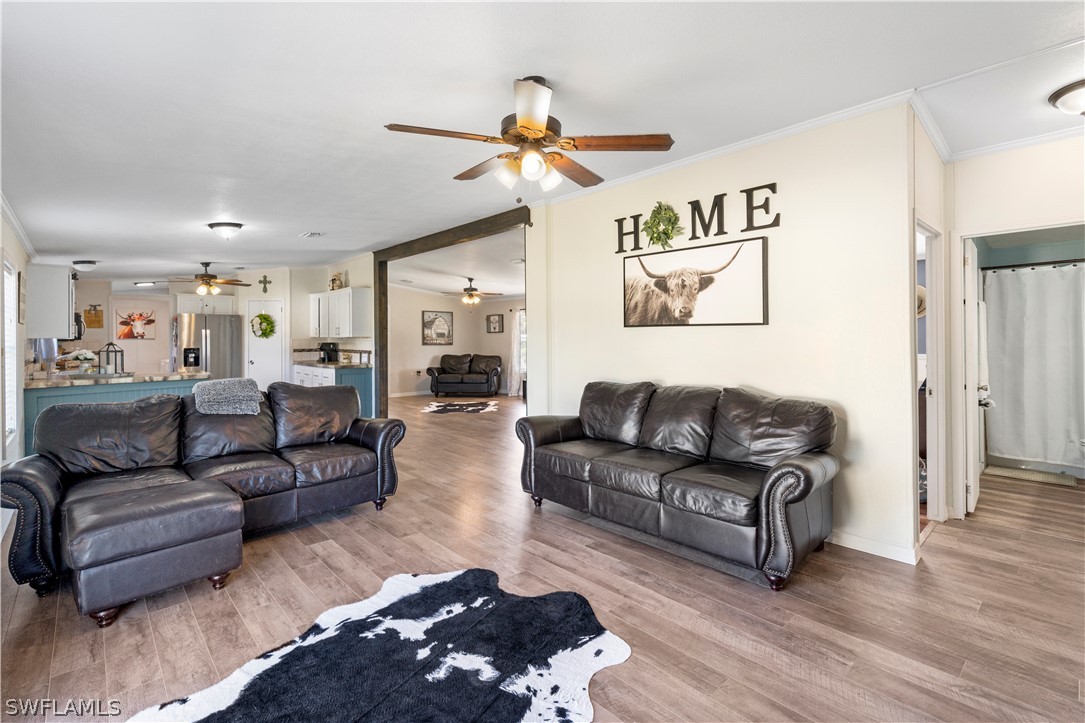 2401 Wendy Road Fort Denaud, FL 33935 - Photo 22 of 35 a living room with furniture and a ceiling fan