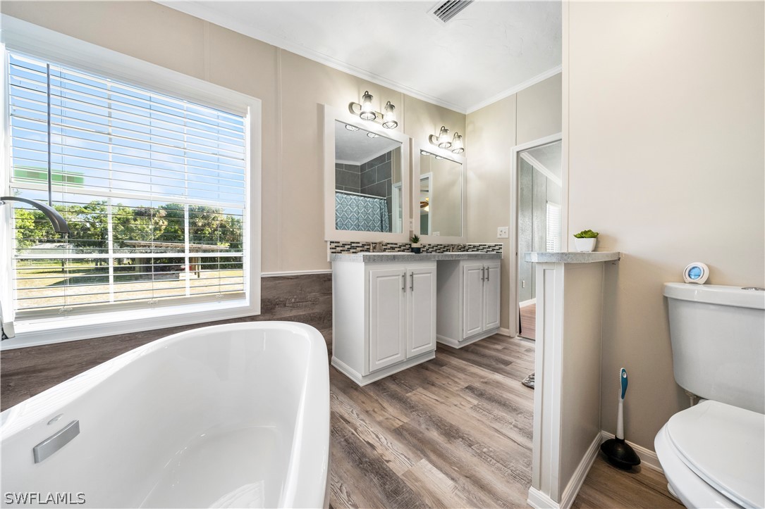2401 Wendy Road Fort Denaud, FL 33935 - Photo 26 of 35 a bathroom with a sink toilet and shower