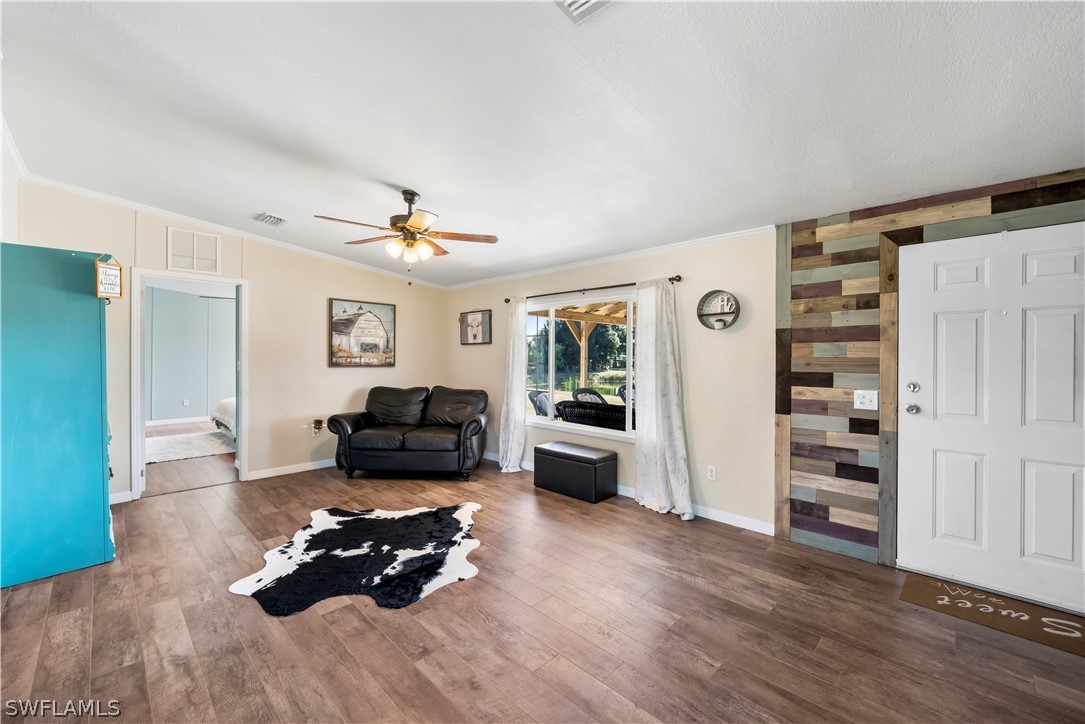 2401 Wendy Road Fort Denaud, FL 33935 - Photo 8 of 35 a living room with furniture and wooden floor