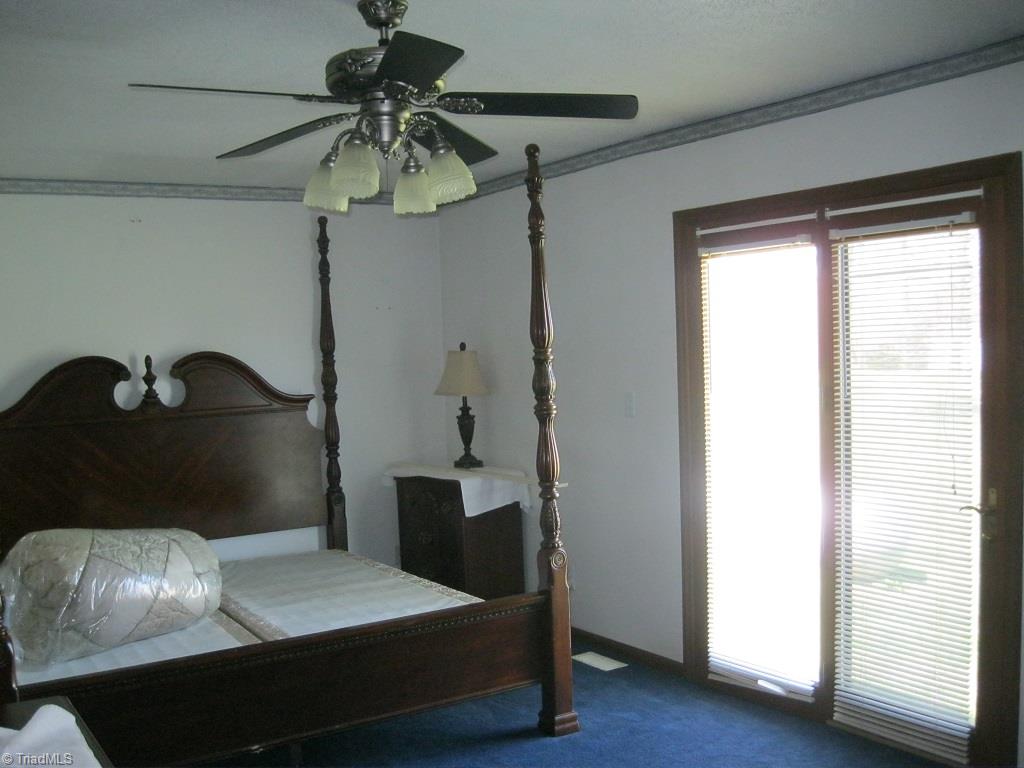3053 Fairview Farm Road Asheboro, NC 27205 - Photo 16 of 19 Natural lighting compliments the master bedroom.
