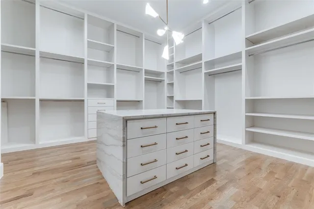 a view of a kitchen with a sink and refrigerator