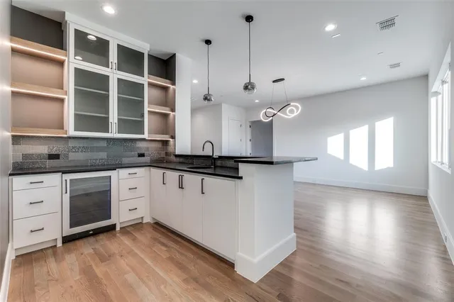 a view of a livingroom with furniture and chandelier fan