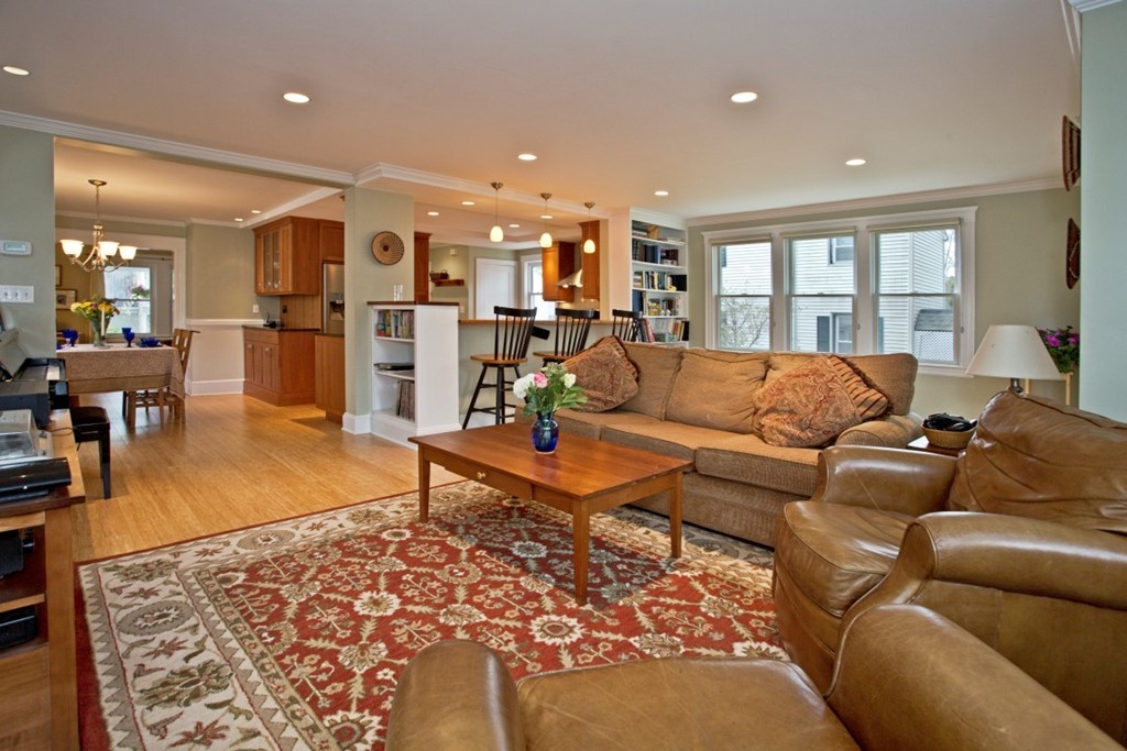 11 Brattle Place Arlington, MA 02474 - Photo 11 of 30 a living room with furniture a wooden floor and kitchen view
