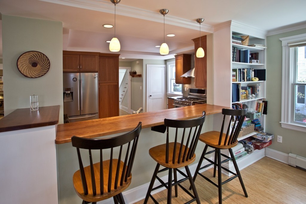11 Brattle Place Arlington, MA 02474 - Photo 12 of 30 a dining room filled chandelier and wooden floors