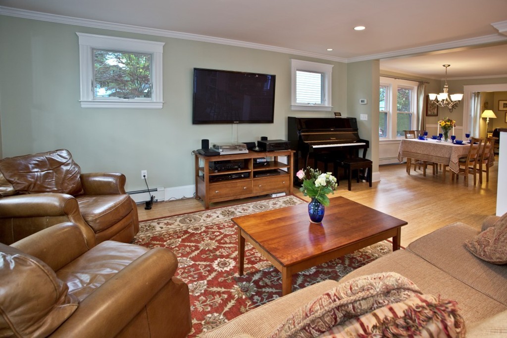 11 Brattle Place Arlington, MA 02474 - Photo 14 of 30 a living room with furniture a flat screen tv and a dining table
