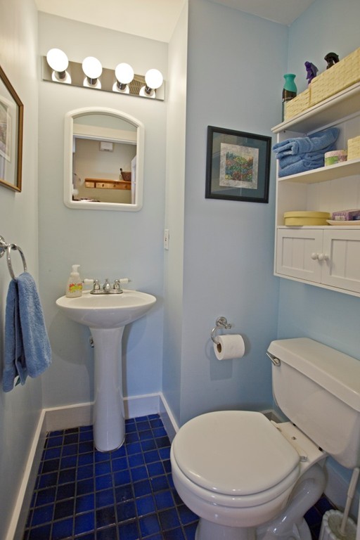 11 Brattle Place Arlington, MA 02474 - Photo 19 of 30 a bathroom with a toilet sink and mirror