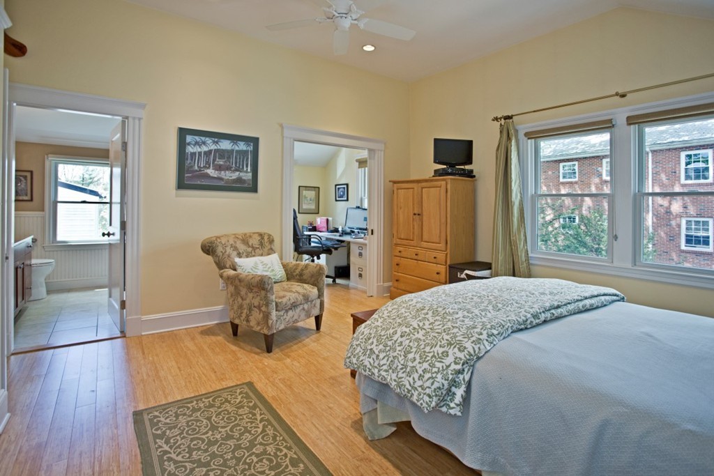 11 Brattle Place Arlington, MA 02474 - Photo 23 of 30 a bedroom with a bed and wooden floor