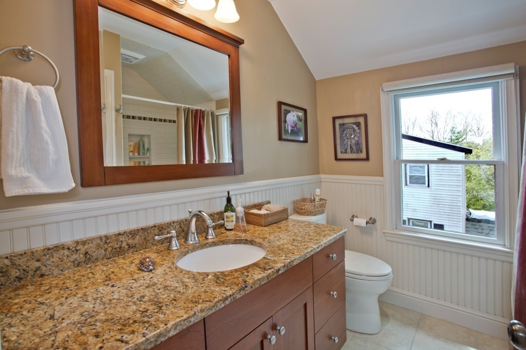 11 Brattle Place Arlington, MA 02474 - Photo 25 of 30 a bathroom with a granite countertop sink mirror vanity and a toilet
