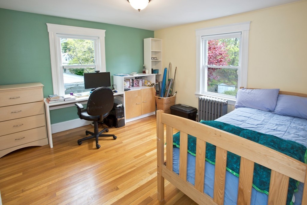 11 Brattle Place Arlington, MA 02474 - Photo 26 of 30 a bedroom with a bed and a desk