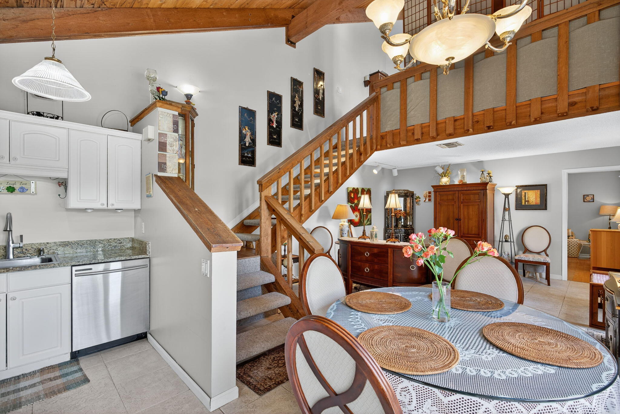 1605 Highway 1, Unit 8E Jupiter, FL 33477 - Photo 12 of 47 a dining room with furniture a rug and wooden floor