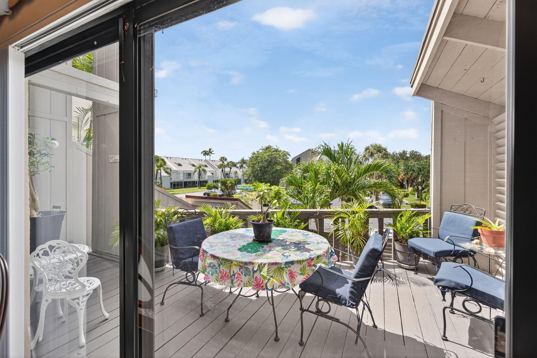 1605 Highway 1, Unit 8E Jupiter, FL 33477 - Photo 14 of 47 a balcony view with a large window and wooden floor
