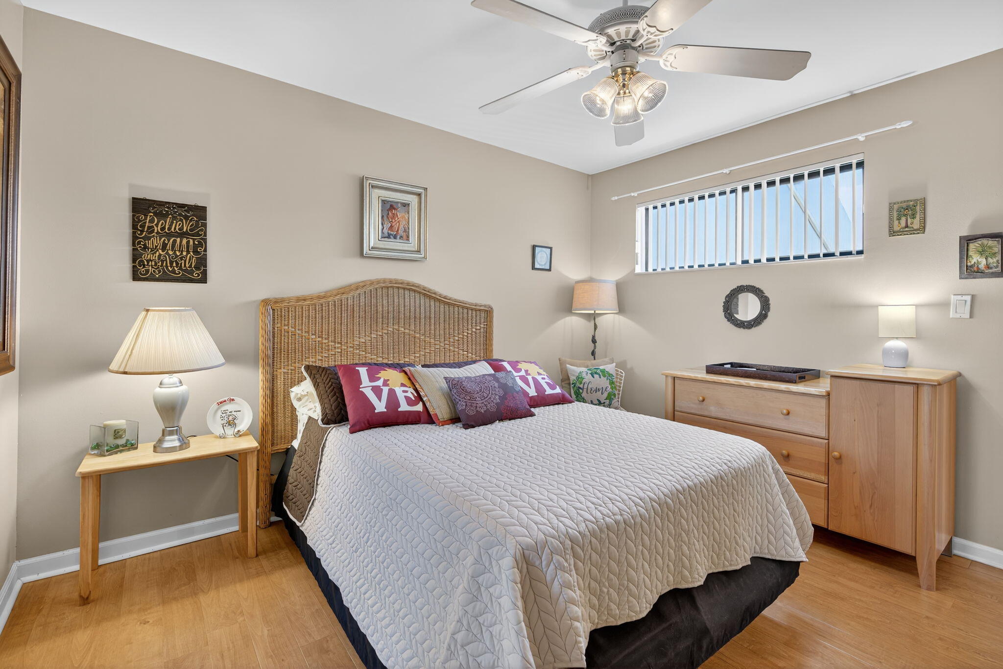 1605 Highway 1, Unit 8E Jupiter, FL 33477 - Photo 16 of 47 a bedroom with a bed and a chandelier