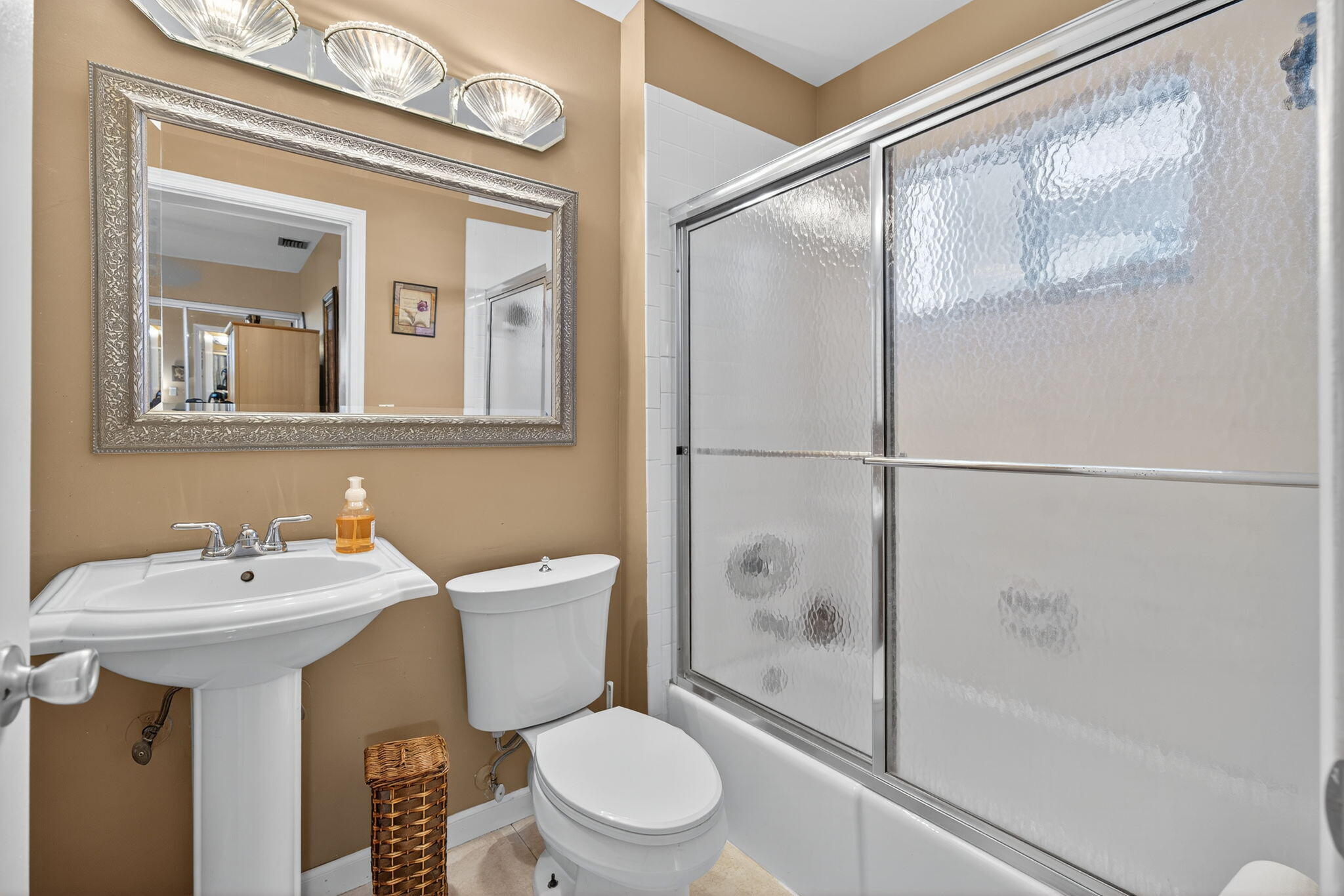1605 Highway 1, Unit 8E Jupiter, FL 33477 - Photo 17 of 47 a bathroom with a sink toilet and shower