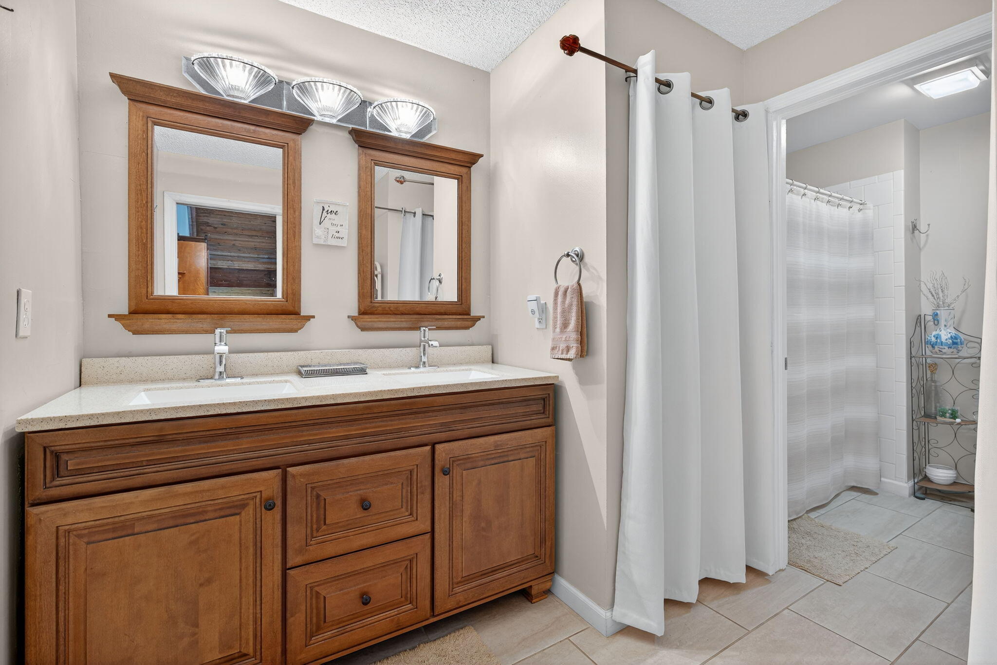 1605 Highway 1, Unit 8E Jupiter, FL 33477 - Photo 21 of 47 a bathroom with a double vanity sink mirror and double